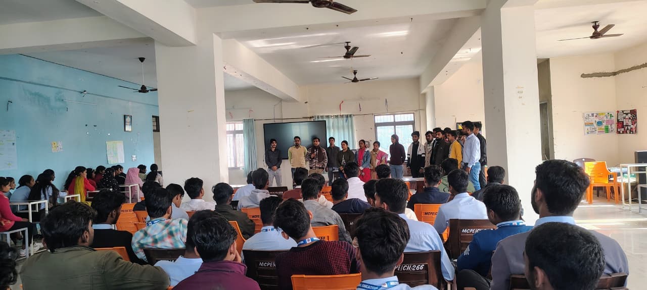 Students attending a guest lecture in the main seminar hall.